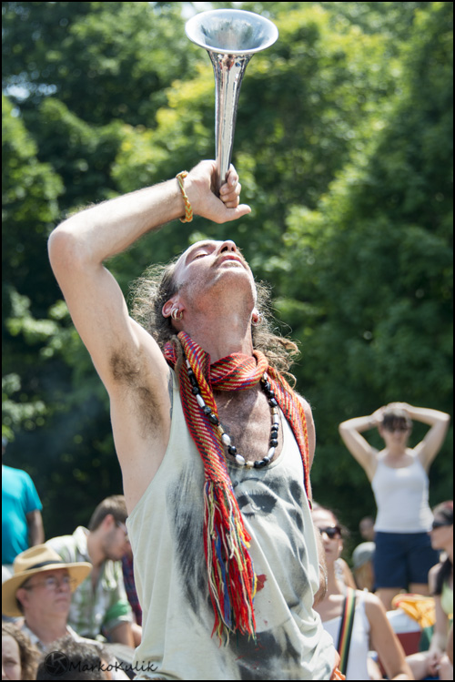 Every Sunday in Montreal, thousands of people gather at Mont-Royale for drumming, dancing etc. This image has no eye contact, but a strong gesture which for me, carries the image.