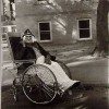 Masked woman in a wheelchair, Pa. - 1970